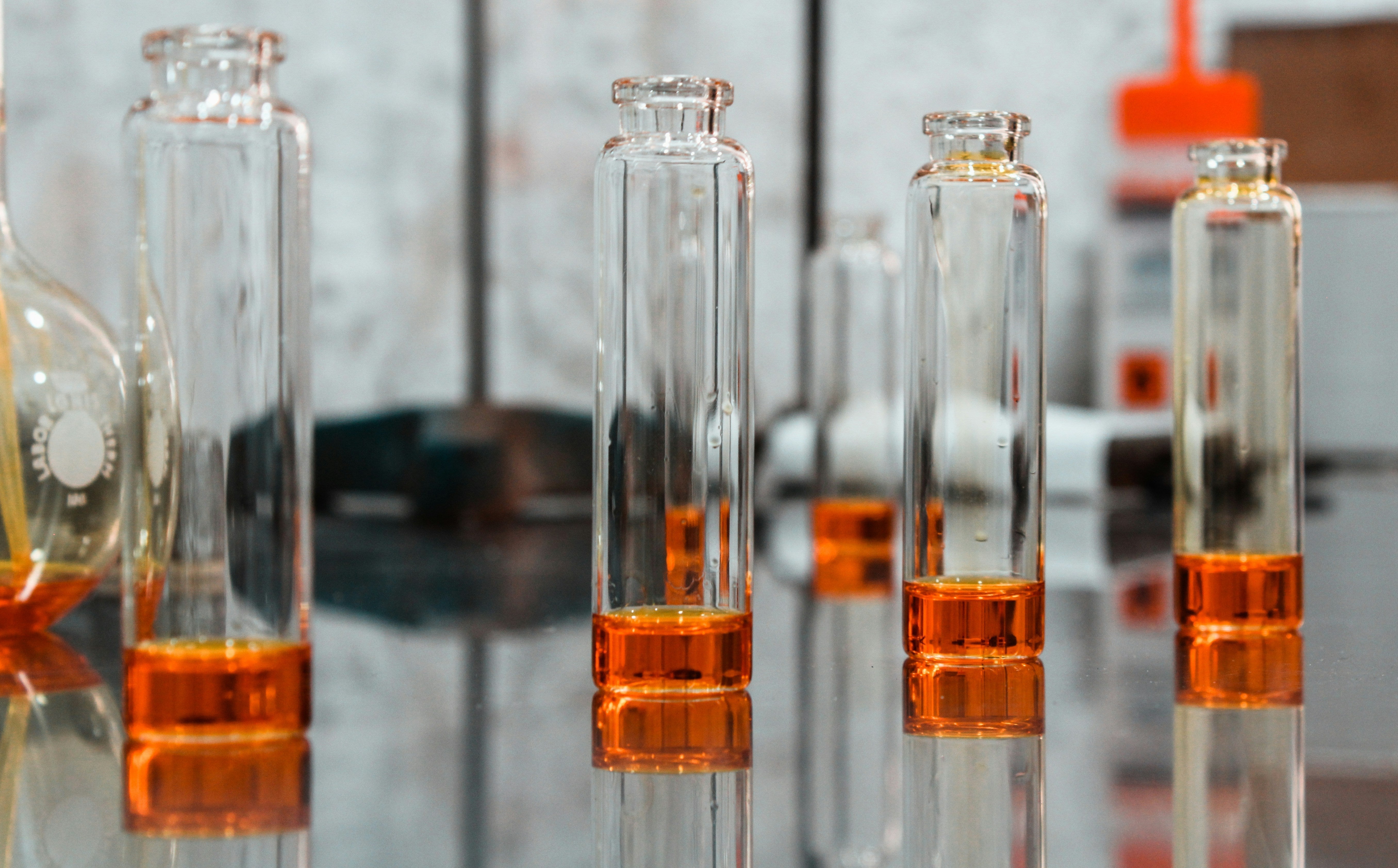 Laboratory vials containing amber liquid samples prepared for analytical testing