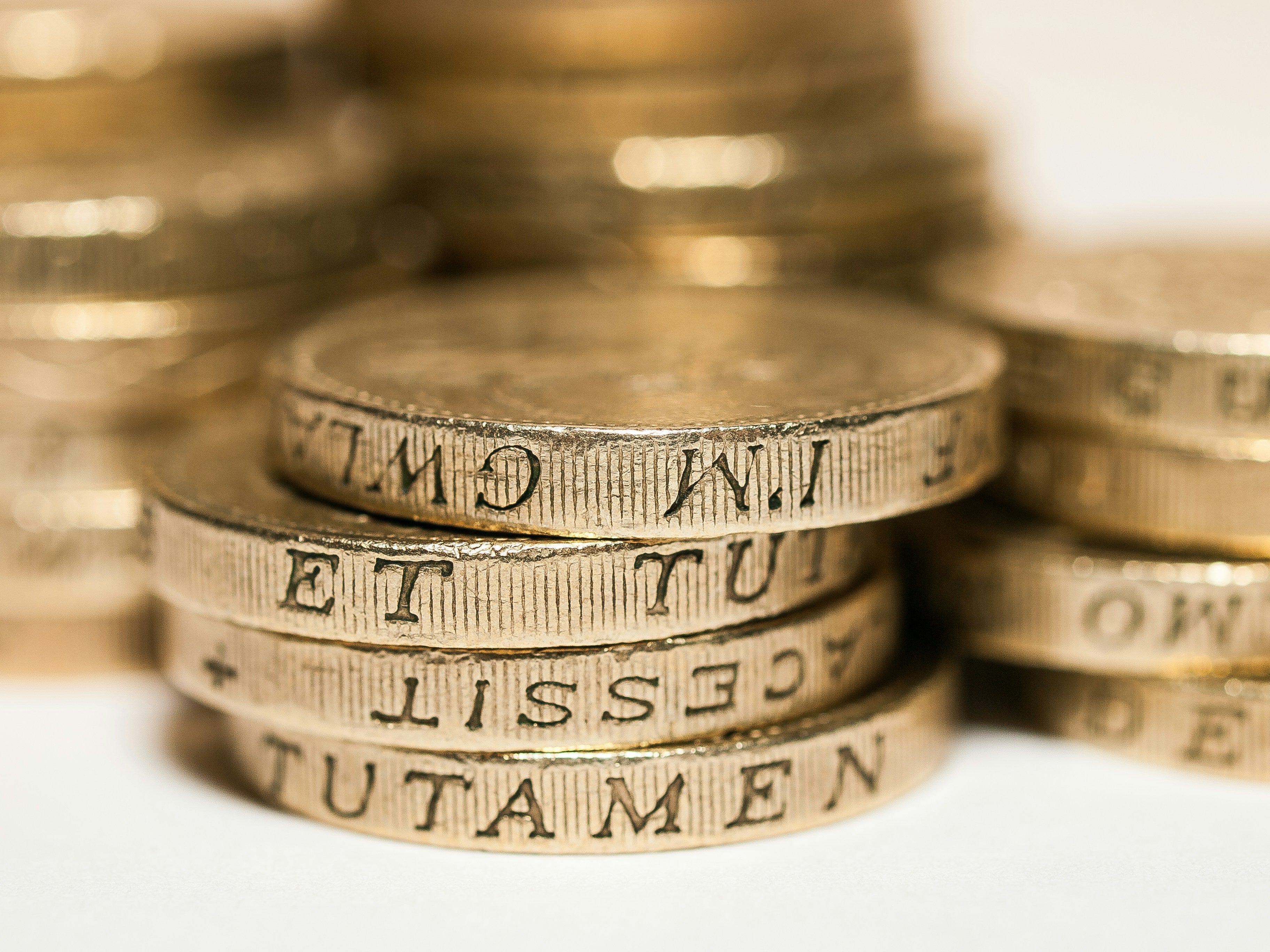 Close-up of British coins used to represent shilajit pricing, product value, and supplement quality.