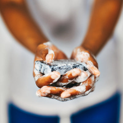 Close up of natural charcoal soap with blurred background