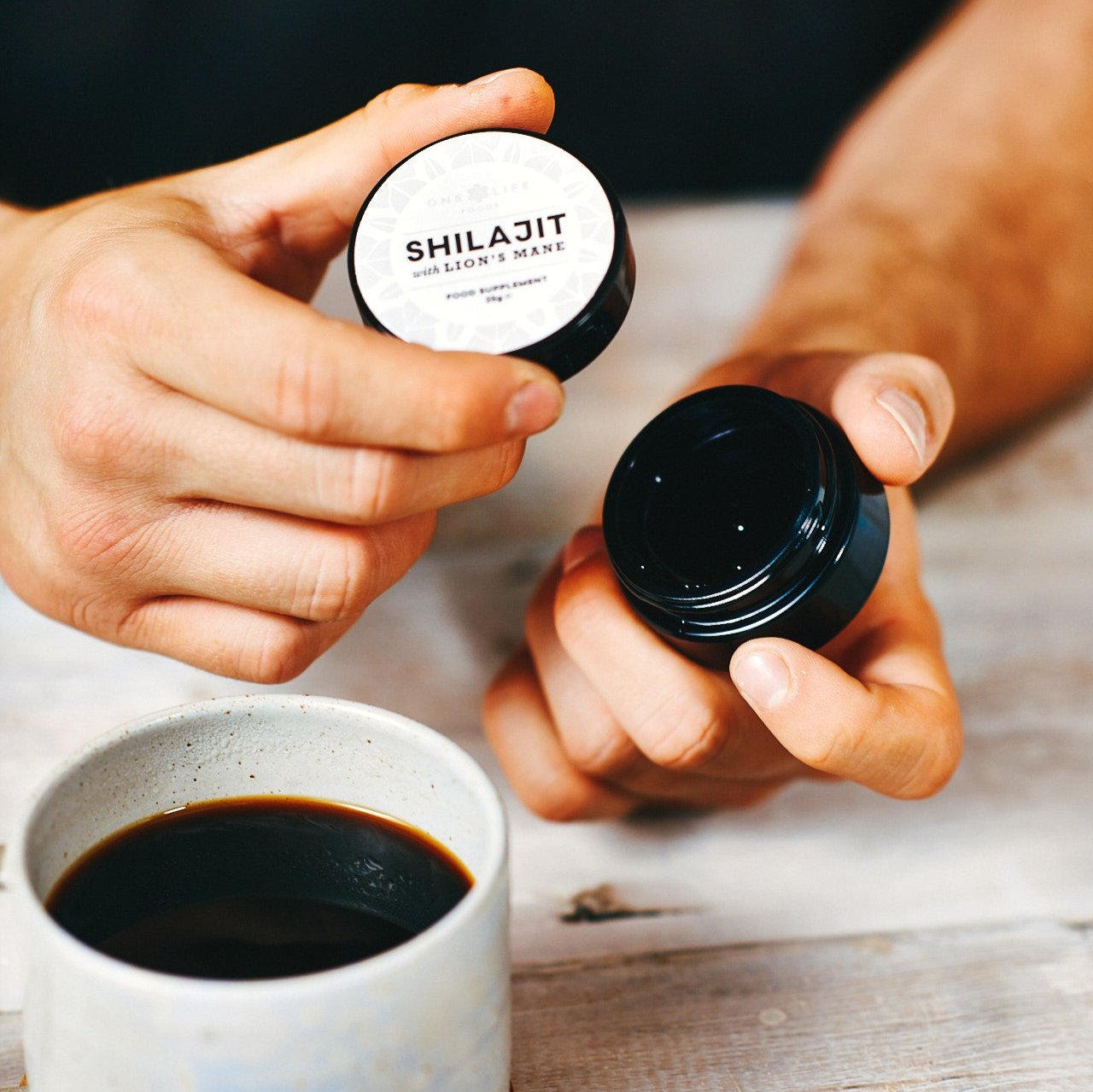 Opening Shilajit and Lion’s Mane resin jar showing product inside.