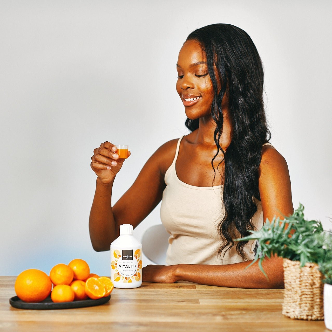 Vitality liquid multivitamin daily serving shot with oranges